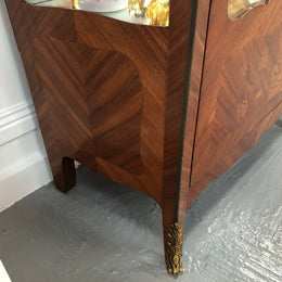 A Louis XV style Kingwood vitrine with marble top. It has beautifully floral inlay with ormolu mounts.