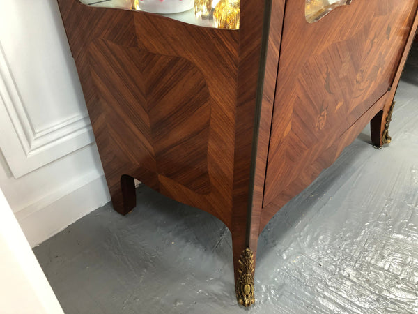 A Louis XV style Kingwood vitrine with marble top. It has beautifully floral inlay with ormolu mounts.