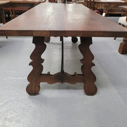 Spanish style French Oak farmhouse table with ironwork underneath. It is in good original detailed condition and has been sourced from France.