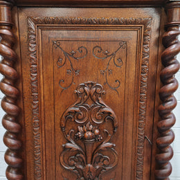French Henry 2nd Oak Side Cabinet of pleasing narrow proportions.  Carving on the cup board and drawer fronts with barley twist columns.