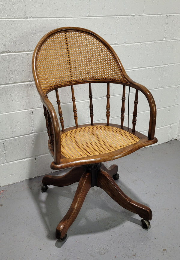 Elm Bentwood and cane swivel desk chair. In good original detailed condition and is comfortable to sit in.