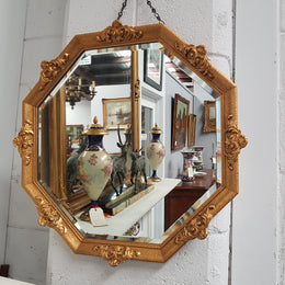 A beautiful Vintage octagon shape ornate gilt mirror, with bevelled glass and in good original condition.