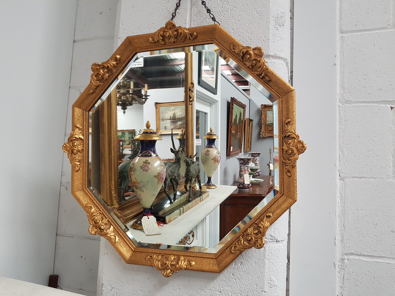 A beautiful Vintage octagon shape ornate gilt mirror, with bevelled glass and in good original condition.