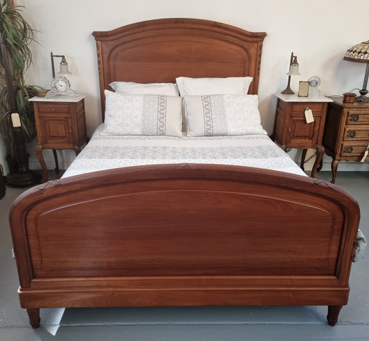 Fabulous French Walnut queen size bed with lovely detail and comes with custom made slates. It is in good original detailed condition.