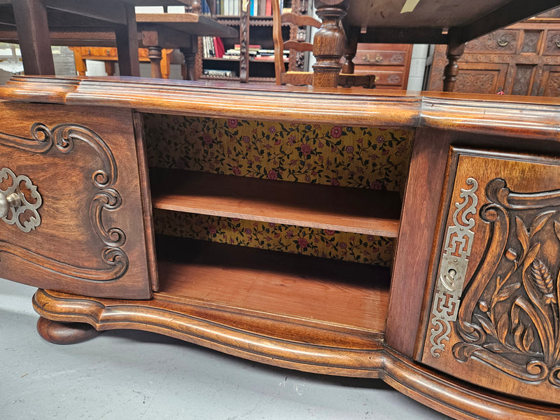Appealing French Louis XVth style walnut converted TV unit.  Central carved  door & 2 Sliding Cupboards. In good condition.