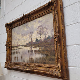 Sourced from France an impressionist oil painting of a beautiful lake scene. It is nicely framed in an Antique frame and in good original detailed condition.