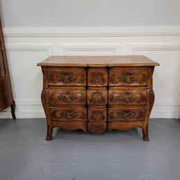 French Antique Louis XIV style Oak wooden top commode. It has a stunning serpentine bombe shape front along with amazing handles and carvings. It comes with three beautiful keys as pictured and comes with working locks. It has been sourced from France and in good original detailed condition.