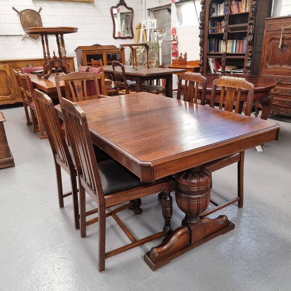Tudor oak dining setting consisting of draw leaf extension table, 4 dining chairs and 2 carver chairs. Upholstery in excellent condition. Circa: 1930’s. The table, chair and carver chairs are in good original detailed condition.