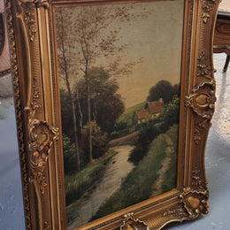 Lovely signed landscape river scene oil on canvas framed in a beautiful ornate frame and in good original condition.