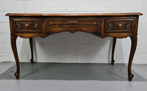 Attractive large Louis XV style Oak faux partners desk. Nicely carved details with three large functioning drawers, and three faux drawers at the back. In good original detailed condition.