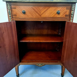 Louis 16th style marquetry inlaid side cabinet with a pierced brass gallery surrounding a marble top. It has two doors open up to storage with one shelf and a drawer above that. In good original detailed condition.