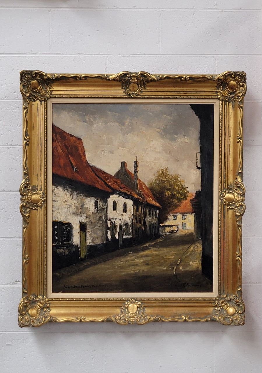 Dutch signed oil on canvas depicting village street in a beautiful gilt frame. It is in good original detailed condition and has been sourced from France.
