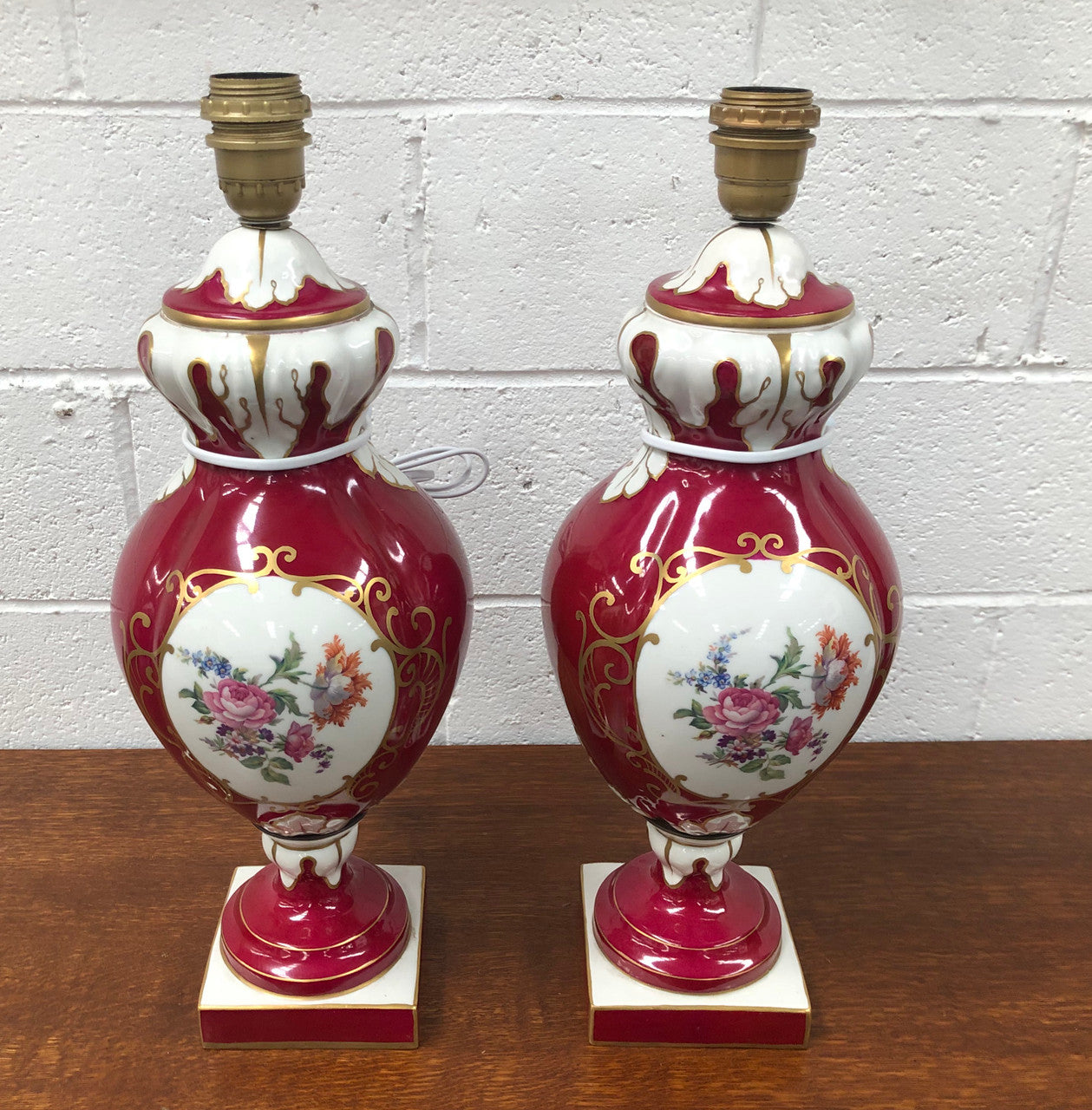 Pair of highly decorative Paris Porcelain table lamps. They are wired to Australian standards and are in very good original condition. Circa 1950's.