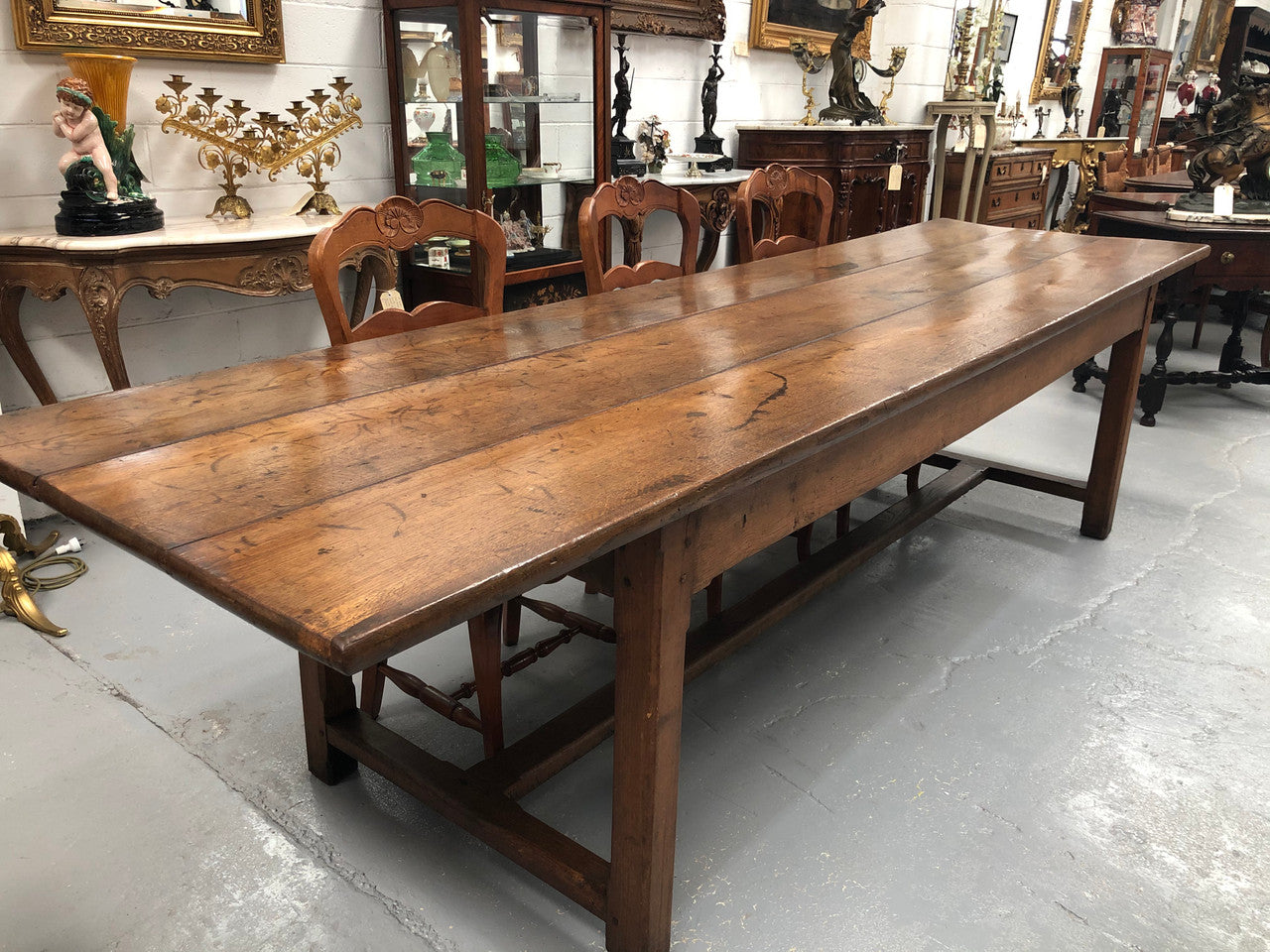 19th Century French three meter Farmhouse table with a beautiful original rustic top. In very good original detailed condition.