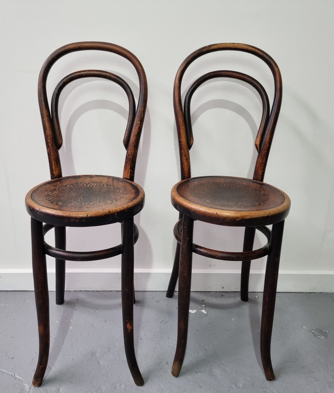 Rare petite cafe Bentwood chairs with original shell embossed seats. They are in very good original condition. They would make great addition to your breakfast bar.