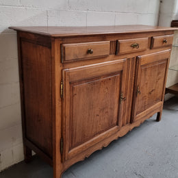 French Oak Early 19th Century sideboard with two doors and three drawers. In good original condition.