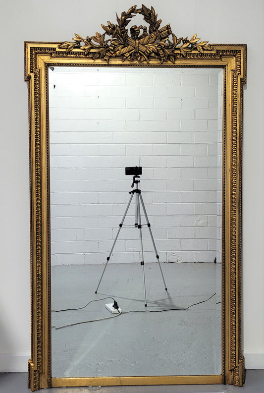 Substantial Louis XI style French Antique over mantel mirror. It is in very good restored condition.