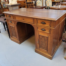 Lovely French Oak carved desk with four drawers and two cupboards. It is in good original detailed condition.