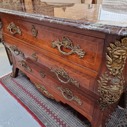 French Louis XVI style three drawer commode with amazing coloured marble. It has decorative brass mounts and is in very good original detailed condition.
