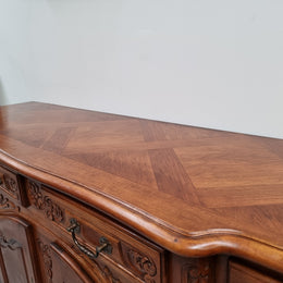 French parquetry top Cherry Wood four-door and four-drawer sideboard. Very decorative carving and is in good original condition.