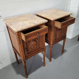 Pair of Louis XV French Oak and marble top bedside cabinets. They have beautiful detailed carving and stunning colour marble top. They are in very good original detailed condition.