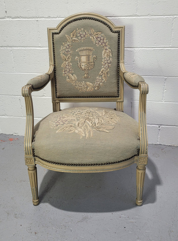 Lovely Louis XVI style painted fauteuil with lovely sage coloured tapestry upholstery. In good original condition.