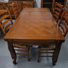 French Oak Louis XV style parquetry top extension table. It can sit six people when not extended and eight when fully extended. It has been sourced from France and is in original detailed condition.