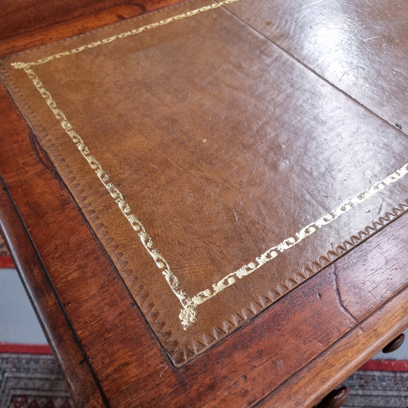 Lovely Victorian Cedar leather tooled  top desk, with five drawers on castors and of pleasing proportions. In very good original detailed condition and has been sourced locally.