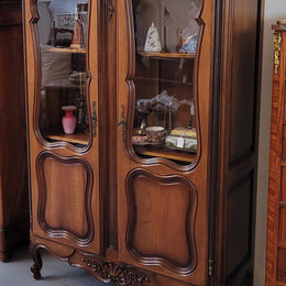 French Walnut Louis XV Style two half glass, door bookcase with three adjustable shelves. Sourced from France and in good original detailed condition.