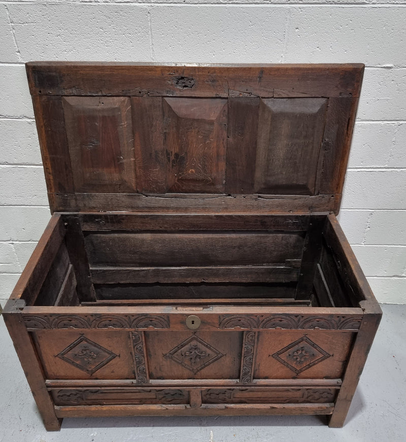 Early 19th Century French Oak carved coffer with a lift up lid for storage. A beautiful piece and in good original condition.