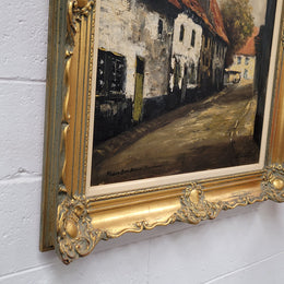 Dutch signed oil on canvas depicting village street in a beautiful gilt frame. It is in good original detailed condition and has been sourced from France.