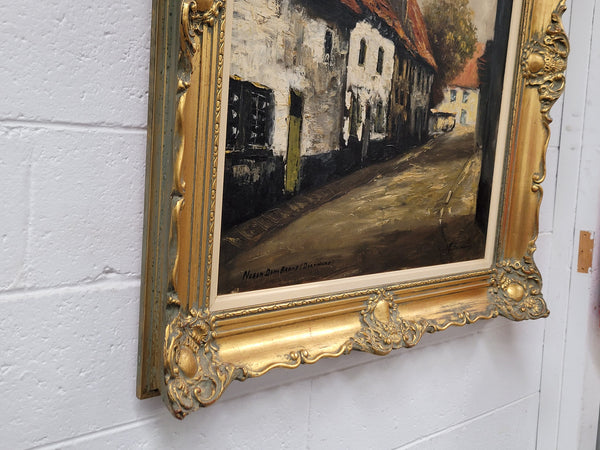 Dutch signed oil on canvas depicting village street in a beautiful gilt frame. It is in good original detailed condition and has been sourced from France.