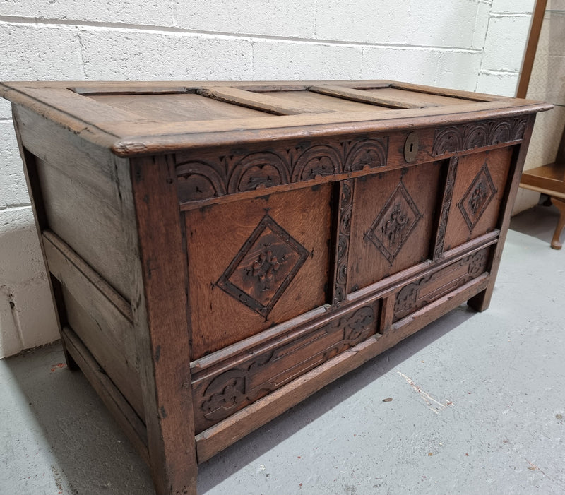 Early 19th Century French Oak carved coffer with a lift up lid for storage. A beautiful piece and in good original condition.