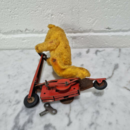 "Gebruder Fendi" bear riding scooter wind up toy, comes with original key. In good original condition, please view photos as they help form part of the description.