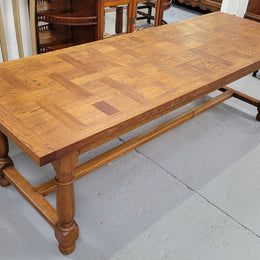 French Oak Refectory dining table with a parquetry top. Sourced from France this table comfortably sits eight to ten. It is in good original detailed condition.