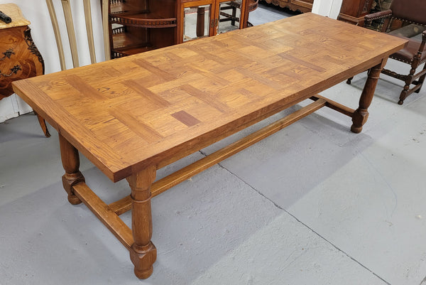 French Oak Refectory dining table with a parquetry top. Sourced from France this table comfortably sits eight to ten. It is in good original detailed condition.
