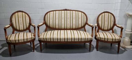 French carved Walnut Louis XV style settee and two matching armchairs. They are in good condition with upholstery also in good condition.