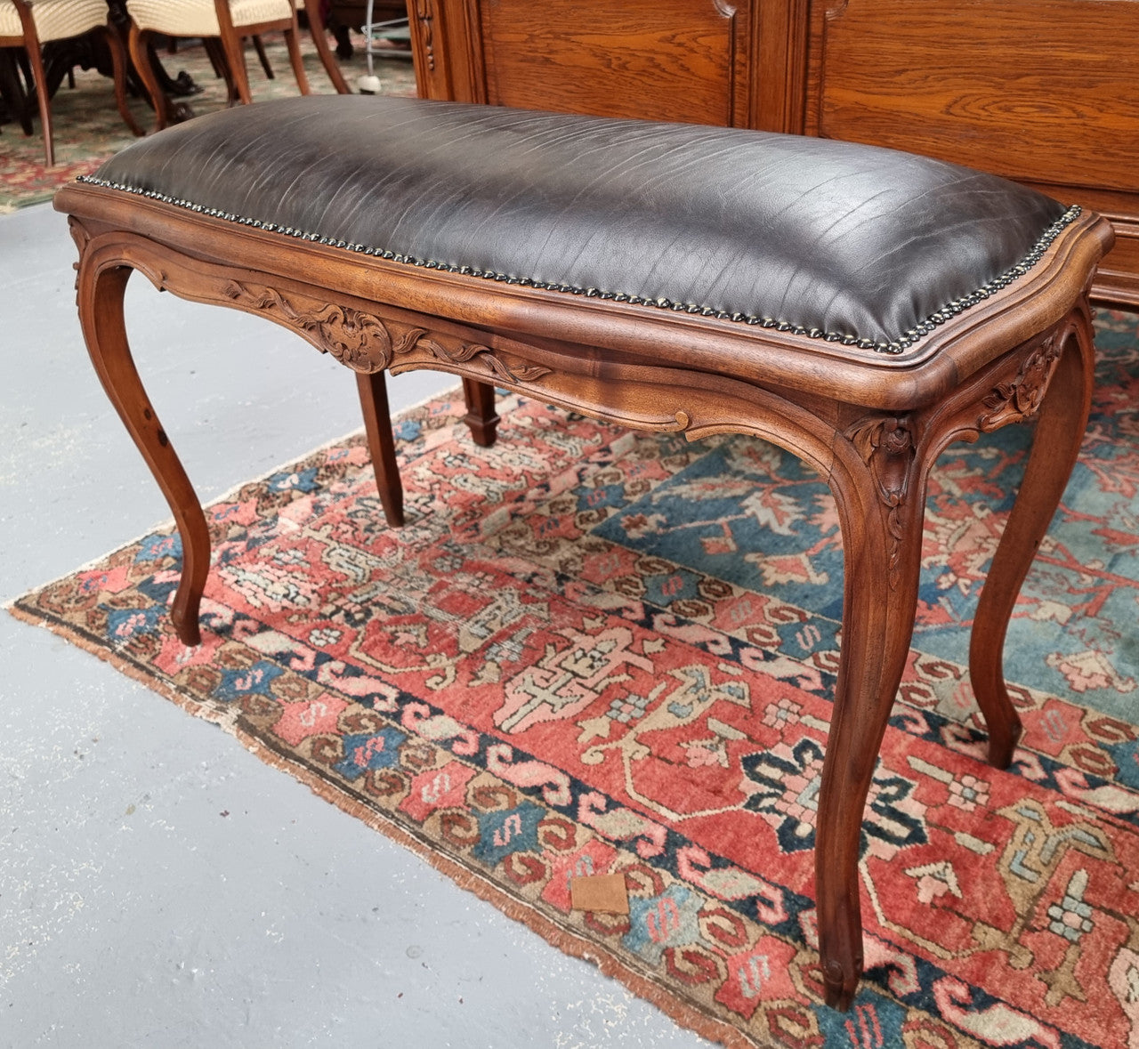 Impressive French Louis 15th style walnut upholstered duet leather stool. Very Good Condition.  Circa: 1930’s, sourced in France.