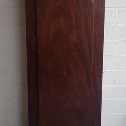 Unusual Victorian Flame Mahogany side wardrobe with side door. It has full hanging and six hooks. The wardrobe opens from a side door which can be locked with its key and has a markers mark stamp on the door. It is in good original condition.
