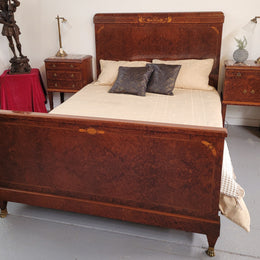 French Art Deco bedroom suite consisting of queen size bed in Amboyna wood and featuring pretty inlay. It comes with a matching pair of bedsides. It is a very stylish and high quality suite. It has been sourced from France and is in good original detailed condition.
