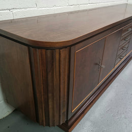 Amazing French Walnut Art deco four door buffet. The doors either side open to a fixed shelf and plenty of added storage with four drawers. In good original detailed condition.