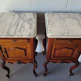 Pair of Louis XV style Walnut bedside cabinets marble top. Circa 1900 and in good original detailed condition.