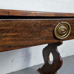 French dark Oak two drawer console table. It has loads of character and is in good original detailed condition.