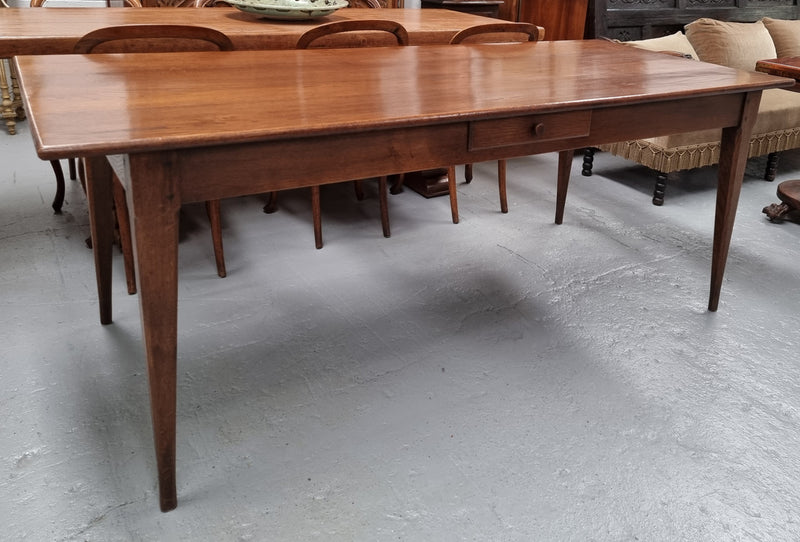 Antique French Oak Farmhouse table in fully restored condition. Features a single drawer and tapered legs.