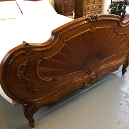 French queen size Walnut beautifully carved bed with inlay depicting the Sun . It has comes with steel rails and custom made slats all you need to do is put your mattress straight on top. In very good original detailed condition.