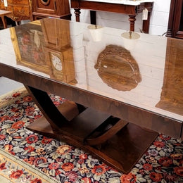French Art Deco Figured Walnut dining table and six chairs. This stylish table also comes with a glass top and can be used with or without it. The chairs are very comfortable and the table can also fit another two chairs at either end making it a 6-8 seater. The table is in good original detailed condition with character marks to the top of table as shown in the pictures. This table and six chairs have been sourced locally.