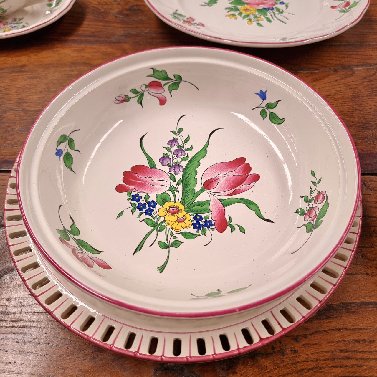 A pretty French table setting made in France called Luneville. It consists of plates, cups, saucers, tea pot, milk jug, sugar bowl, tureens and cake plates a total of 53 pieces. Please view photos as they help form part of the descriptions.