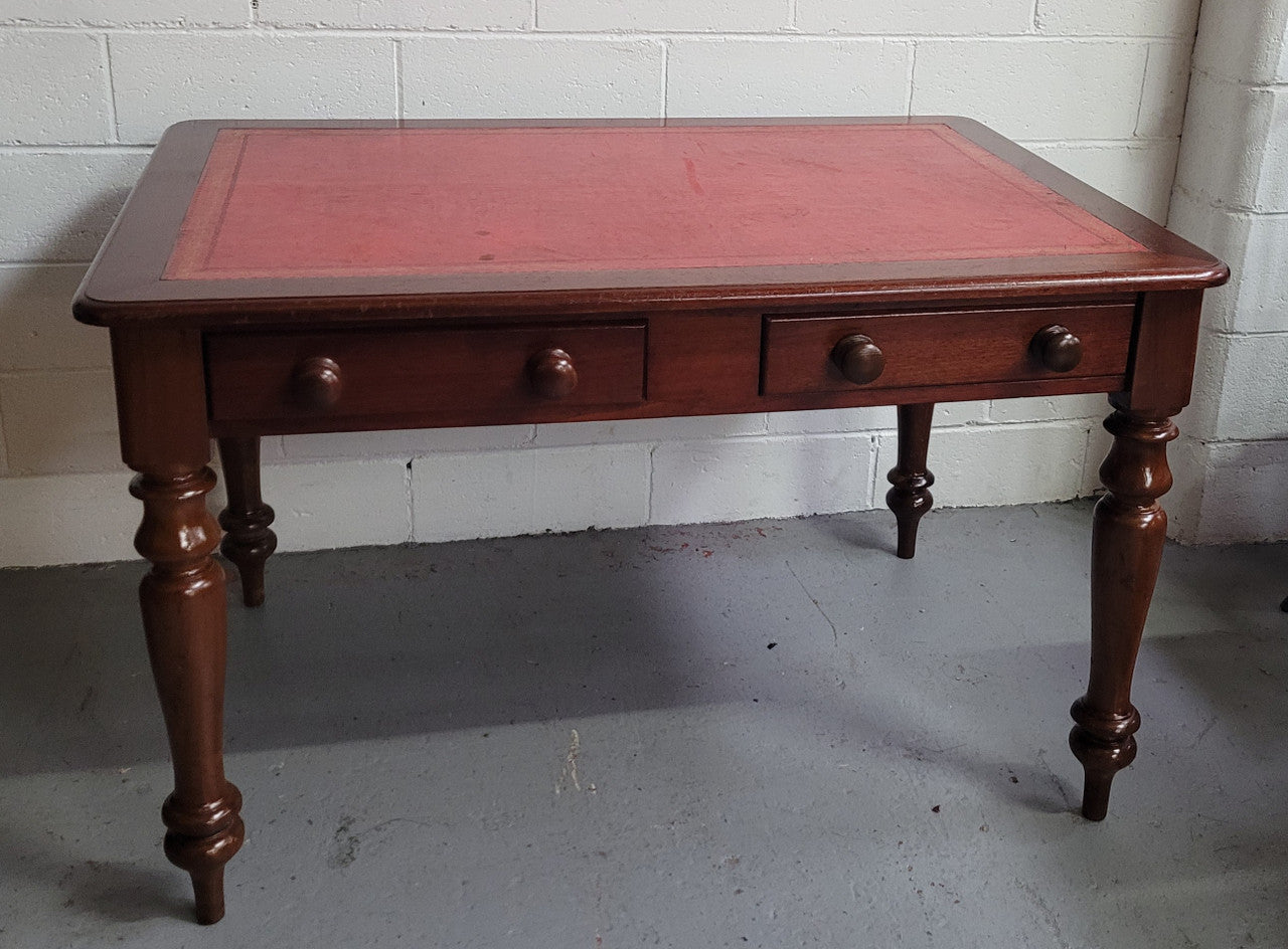 Victorian Cedar two drawer tooled leather topped desk with turned legs. In good original condition.