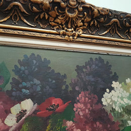 An Antique framed floral painting of lilacs in a vase on canvas, signed and in fantastic original condition.