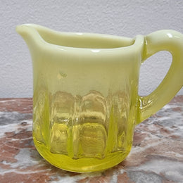 A fabulous rare Vaseline glass small jug and sugar bowl in good original condition.